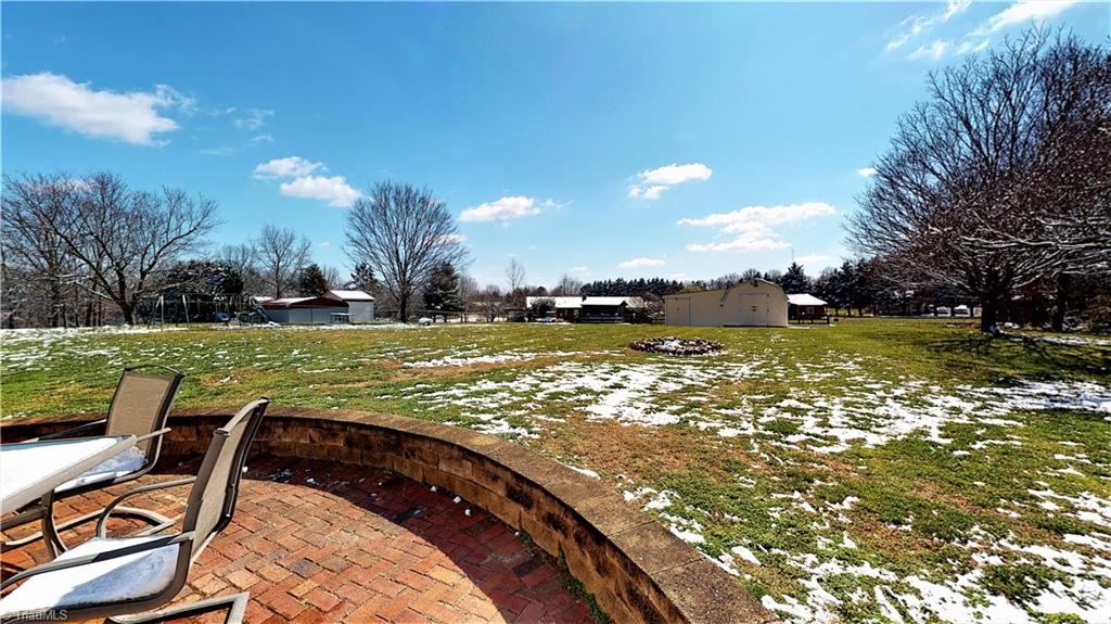 172 Deerfield Country Road Randleman, NC 27317 - Photo 8 of 30 Brick patio is perfect for entertaining and the backyard is great for sports, gardening and dogs! Inground fencing.