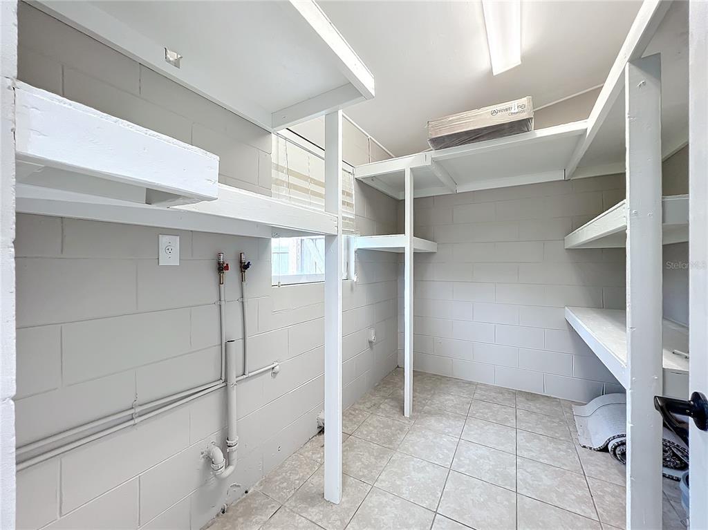 600 Ridgefield Avenue Ocoee, FL 34761 - Photo 35 of 45 Inside utility room is air conditioned with plenty of storage shelving