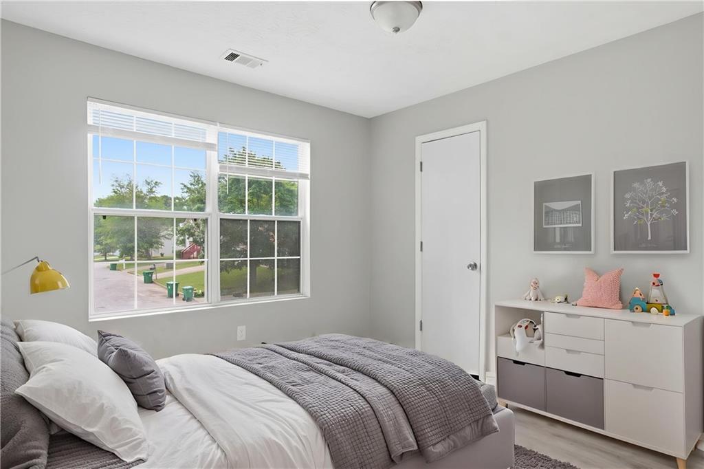 5855 Crescent Ridge Court Lithonia, GA 30058 - Photo 8 of 46 a bedroom with a bed and a window