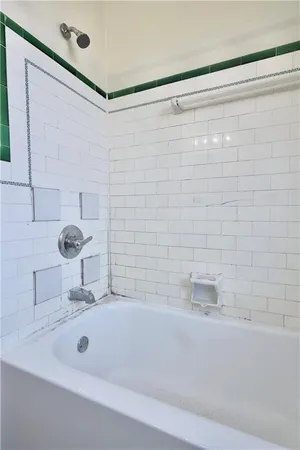 a bathroom with a tub and a sink