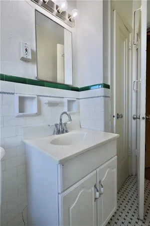 a bathroom with a sink and a mirror