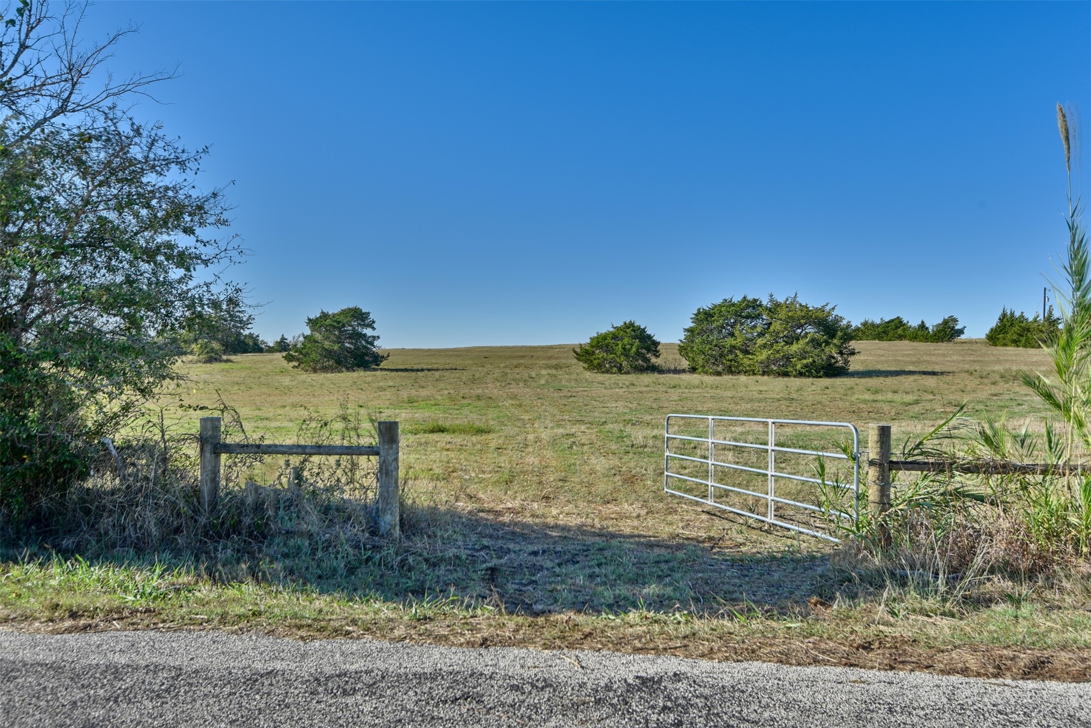 2220 Boehnemann Road Burton, TX 77835 - Photo 18 of 19 a view of a lake with a mountain in the back
