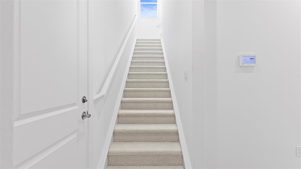 8447 Southwest Felicita Way Port St. Lucie, FL 34987 - Photo 41 of 92 a view of staircase with white walls and white door
