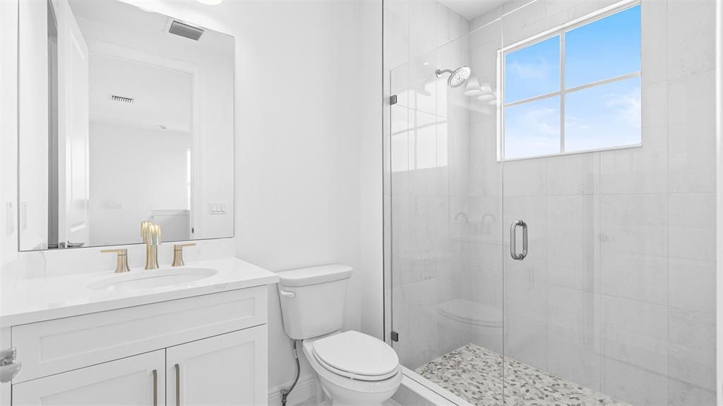 8447 Southwest Felicita Way Port St. Lucie, FL 34987 - Photo 46 of 92 a bathroom with a sink toilet and shower