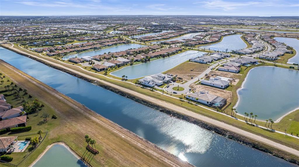 8447 Southwest Felicita Way Port St. Lucie, FL 34987 - Photo 66 of 92 an aerial view of residential houses with outdoor space