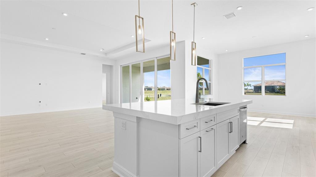 8447 Southwest Felicita Way Port St. Lucie, FL 34987 - Photo 10 of 92 a kitchen with stainless steel appliances a sink and a window