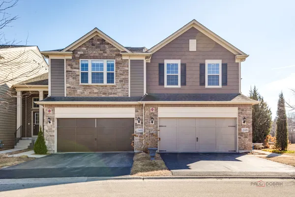 a front view of a house with yard