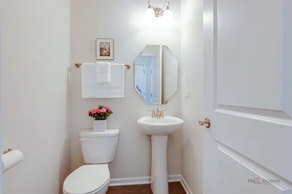 a bathroom with a granite countertop sink a mirror and a shower