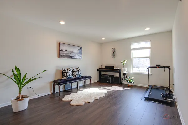 a view of a livingroom with hardwood floor and a livingroom
