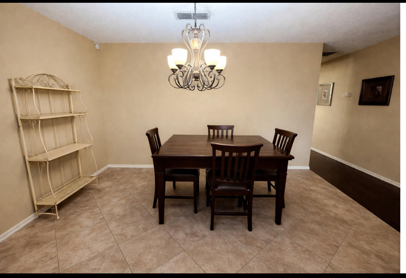 1304 1st Street Lubbock, TX 79401 - Photo 3 of 7 a view of a dining room with furniture and chandelier