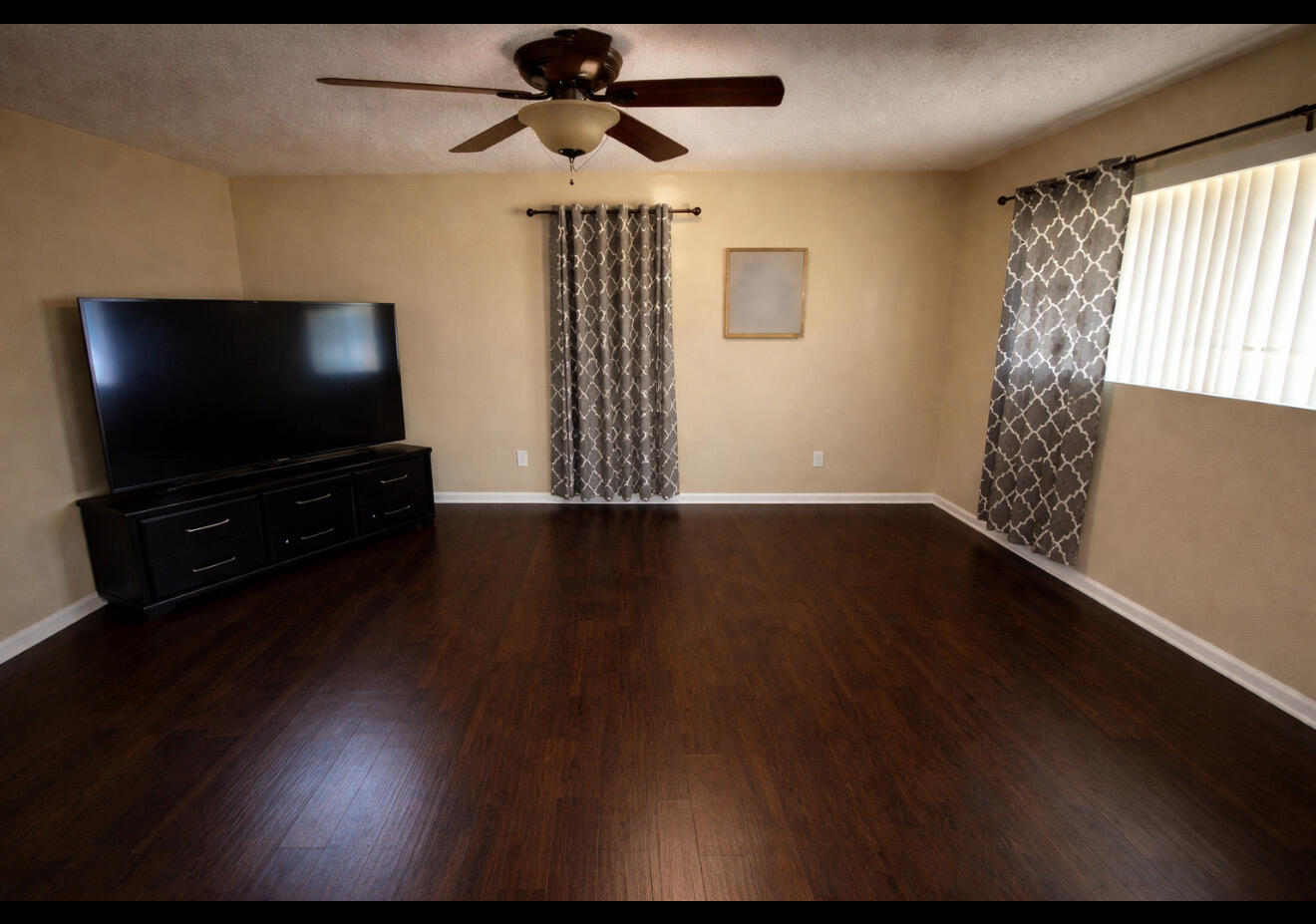 1304 1st Street Lubbock, TX 79401 - Photo 4 of 7 a living room with furniture and a flat screen tv