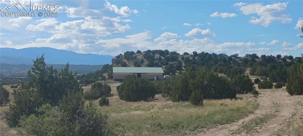 7825 Soda Creek Road Pueblo, CO 81005 - Photo 38 of 40 a view of a backyard with green space