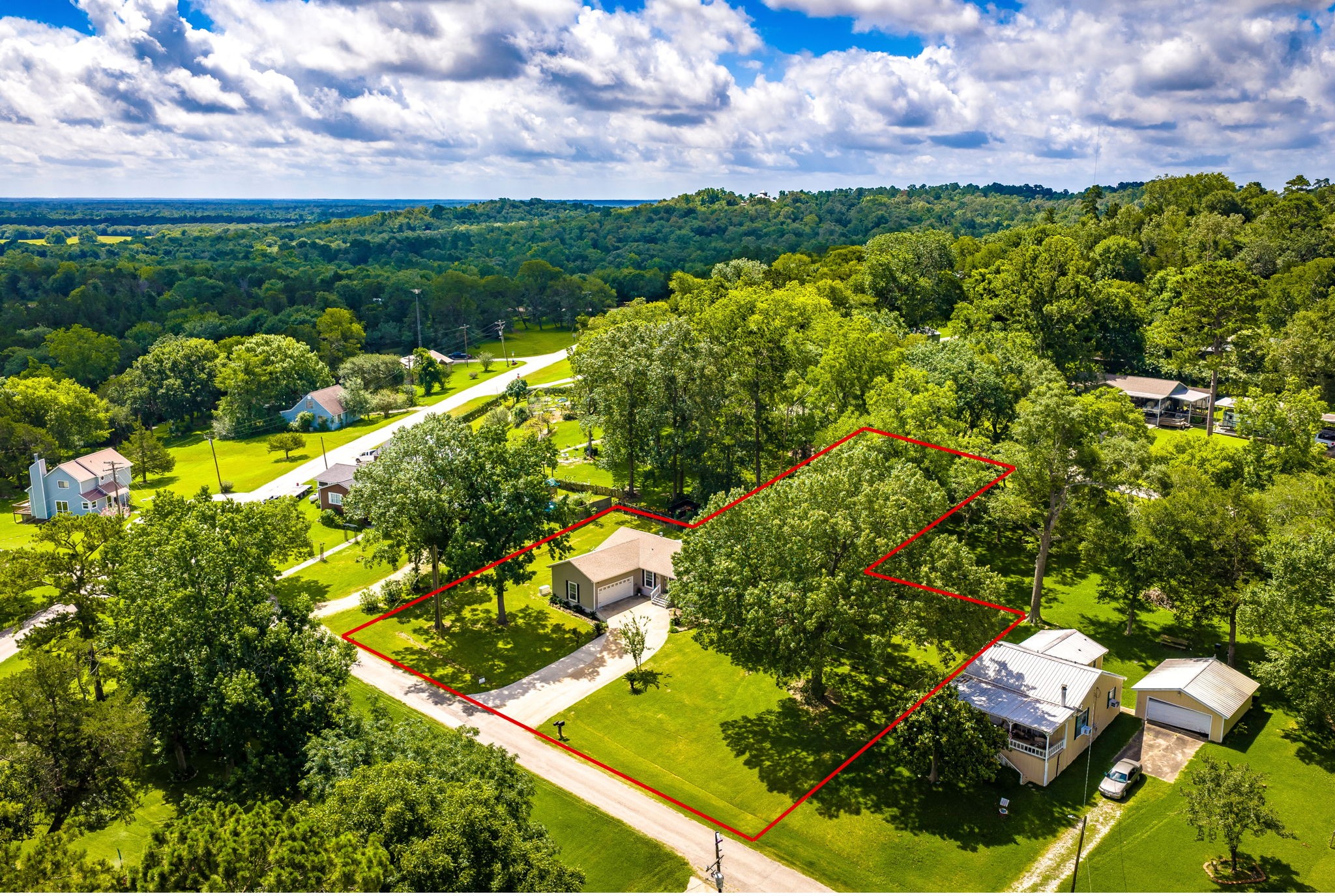 51 Rustling Oaks Coldspring, TX 77331 - Photo 1 of 43 One-Story home on a slab, with mature trees, situated on 3.5 lots (no direct rear neighbors or side neighbors; back lot leads to street behind the house)