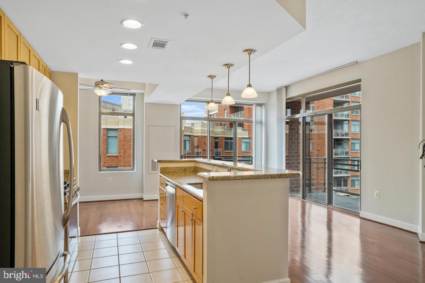 3650 South Glebe Road, Unit 638 Arlington, VA 22202 - Photo 5 of 35 a kitchen with stainless steel appliances granite countertop a refrigerator and a sink