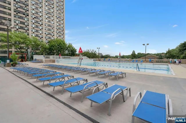 a roof deck with table and chairs