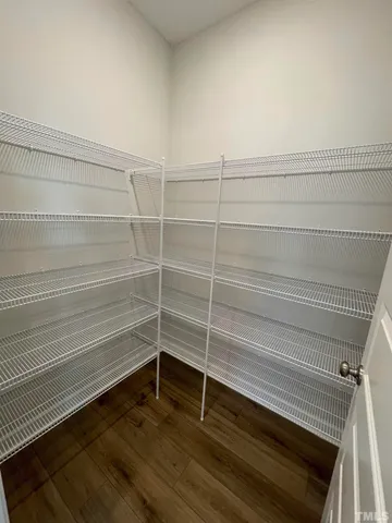 a view of a room with stairs and a wooden floor