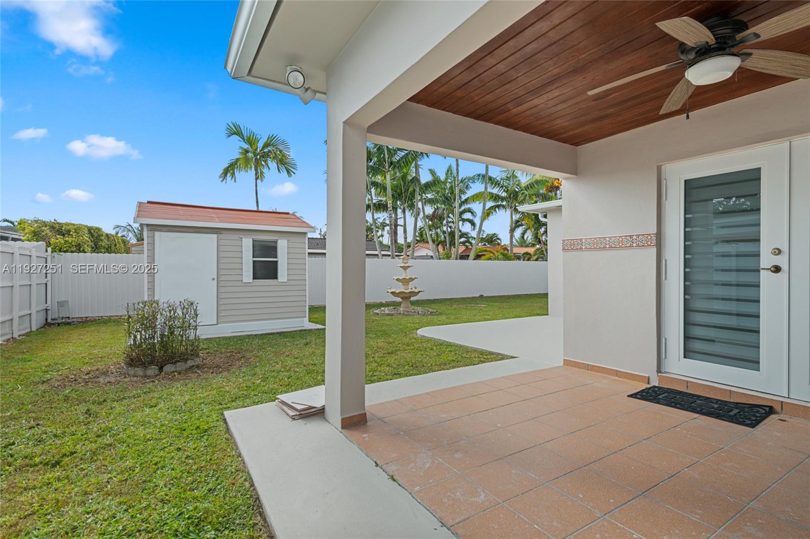 9864 Southwest 26th Terrace Miami, FL 33165 - Photo 30 of 40 a view of an house with backyard and a tree