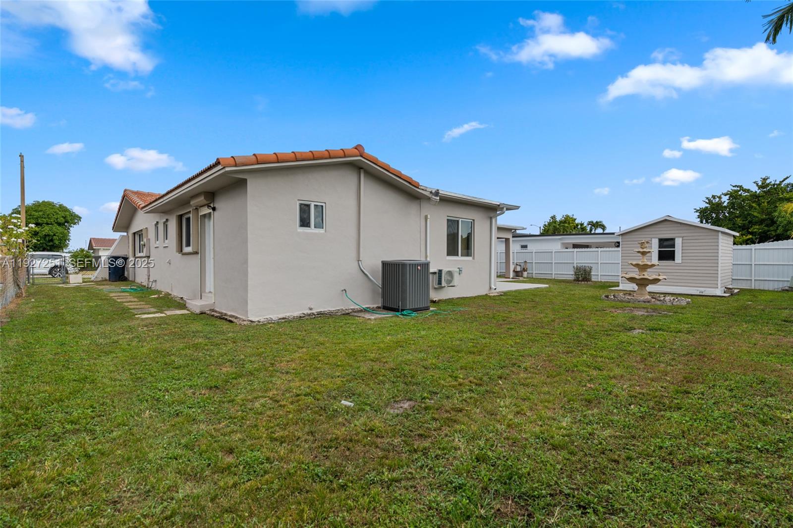 9864 Southwest 26th Terrace Miami, FL 33165 - Photo 32 of 40 a view of a house with a backyard