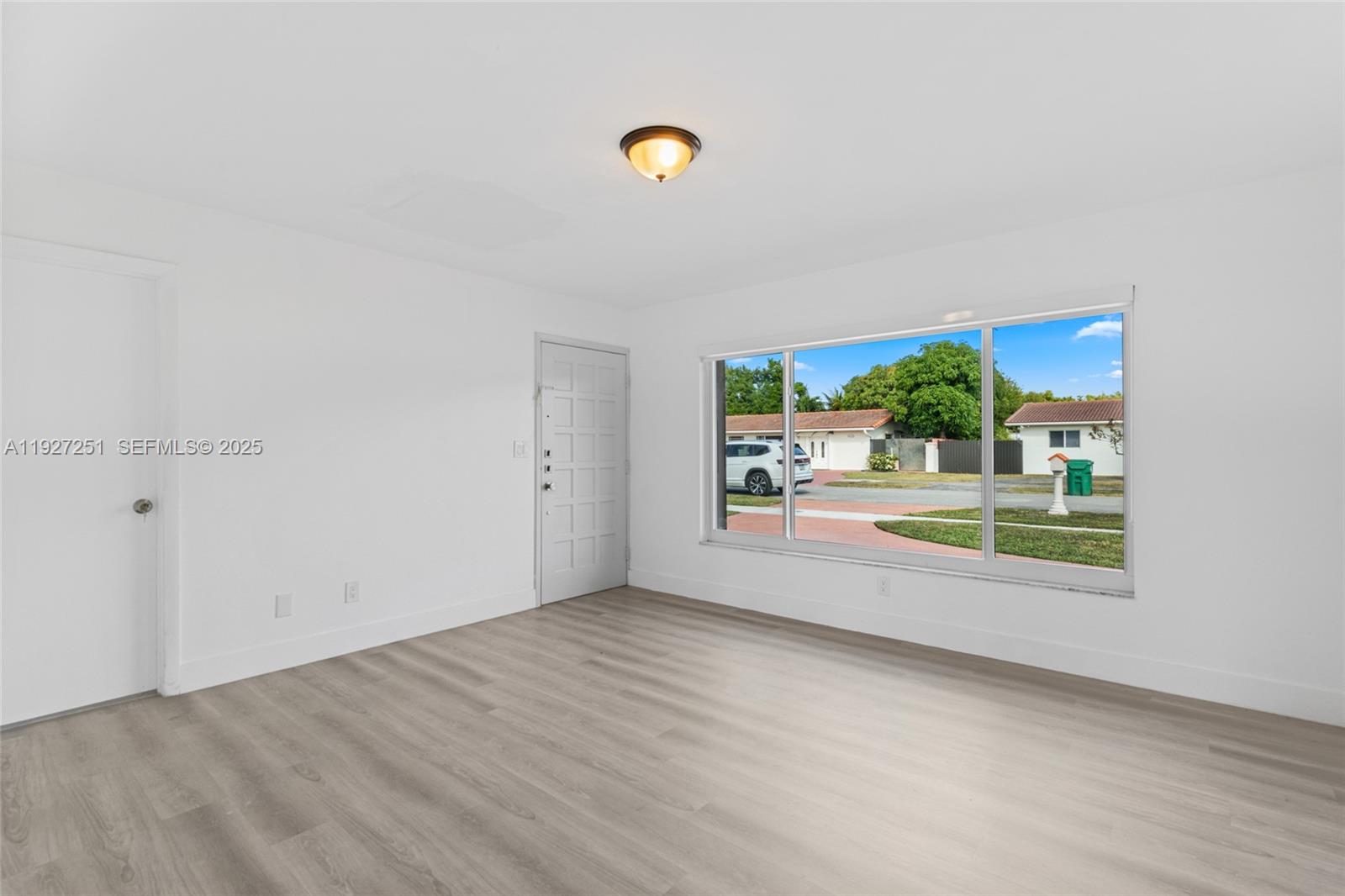 9864 Southwest 26th Terrace Miami, FL 33165 - Photo 8 of 40 a view of an empty room and window