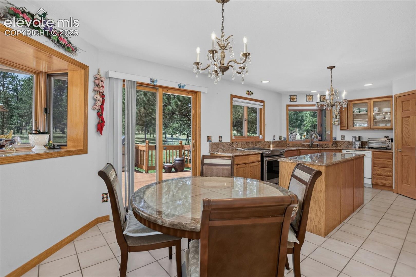 11570 Milford Road Elbert, CO 80106 - Photo 20 of 49 Breakfast area in kitchen with walk out to back deck.