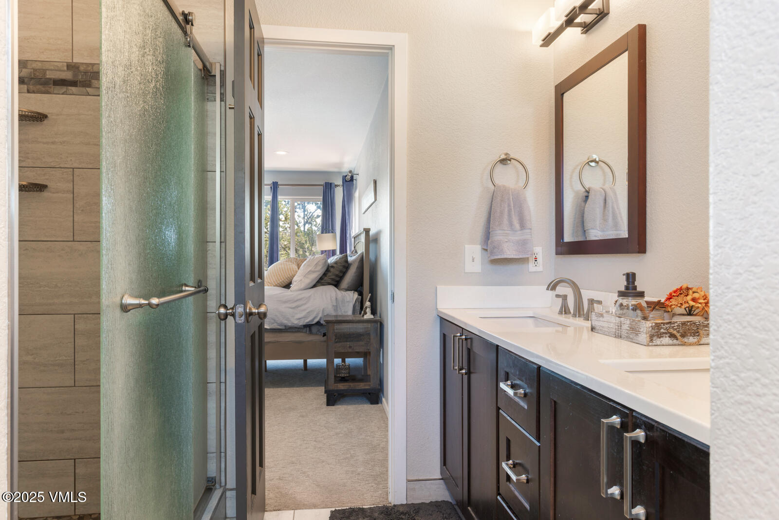 318 Mesa Drive Eagle, CO 81631 - Photo 14 of 44 a en suite bathroom with a sink mirror and vanity