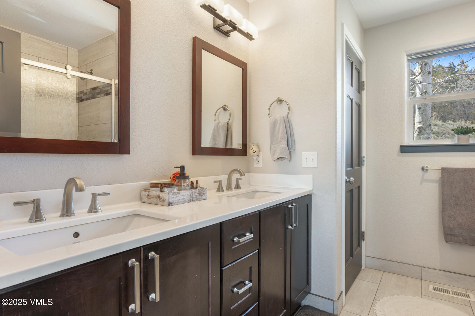 318 Mesa Drive Eagle, CO 81631 - Photo 15 of 44 a bathroom with a double vanity sink mirror and