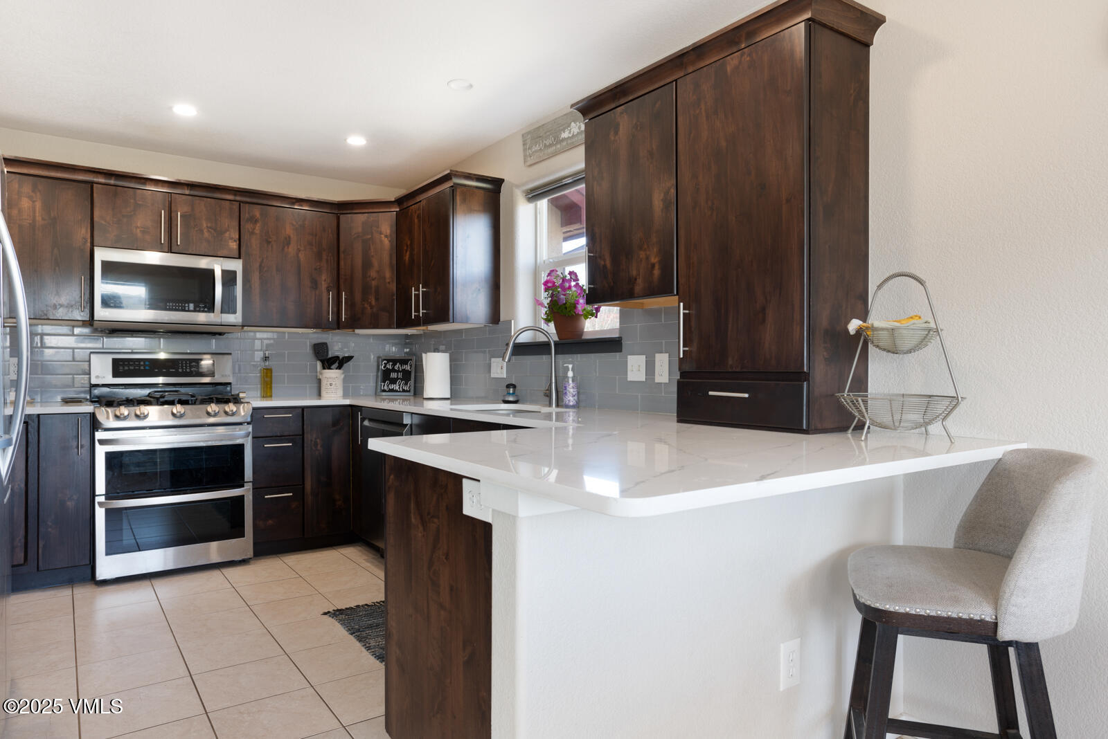 318 Mesa Drive Eagle, CO 81631 - Photo 19 of 44 a kitchen with a sink cabinets and stainless steel appliances