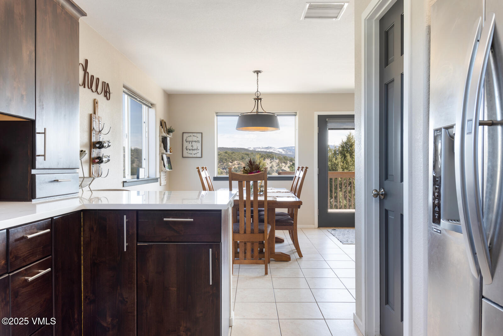 318 Mesa Drive Eagle, CO 81631 - Photo 20 of 44 a kitchen with a sink and chairs
