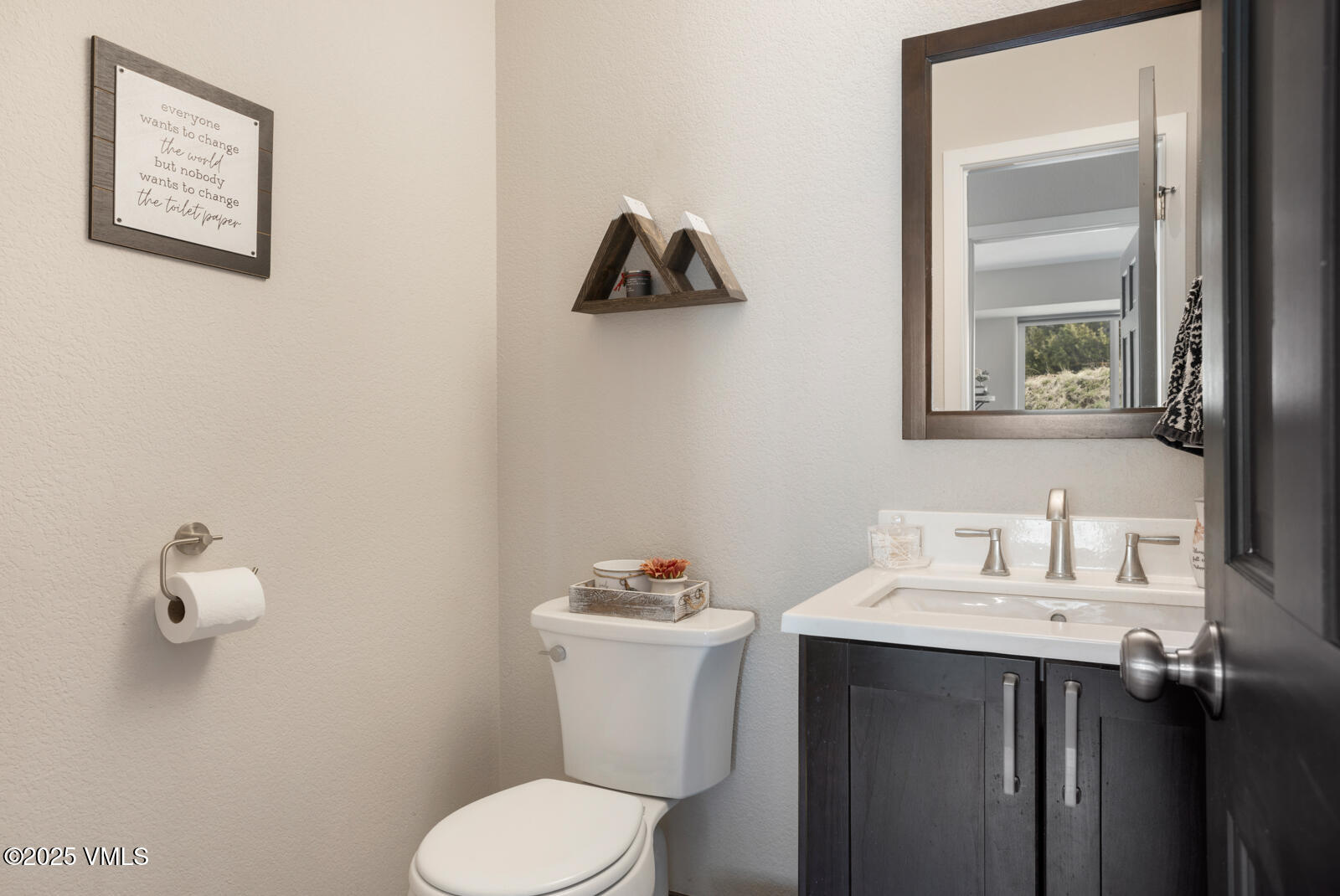 318 Mesa Drive Eagle, CO 81631 - Photo 21 of 44 a bathroom with a toilet sink and mirror