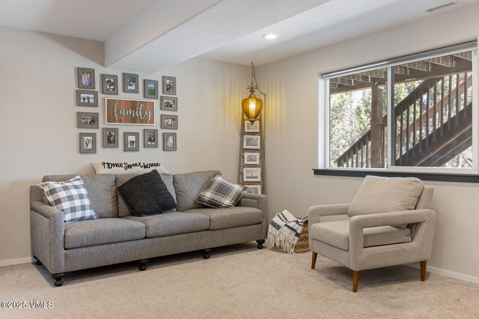 318 Mesa Drive Eagle, CO 81631 - Photo 31 of 44 a living room with furniture and a large window