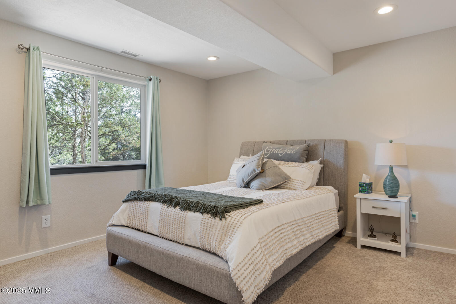 318 Mesa Drive Eagle, CO 81631 - Photo 32 of 44 a bedroom with a bed and a window