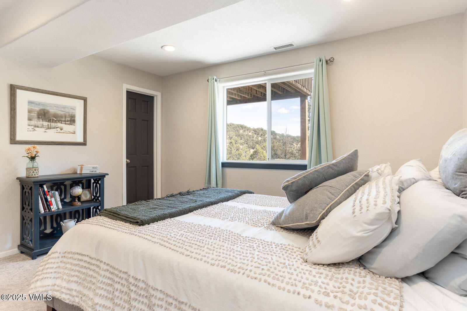 318 Mesa Drive Eagle, CO 81631 - Photo 33 of 44 a bedroom with a bed and a large window