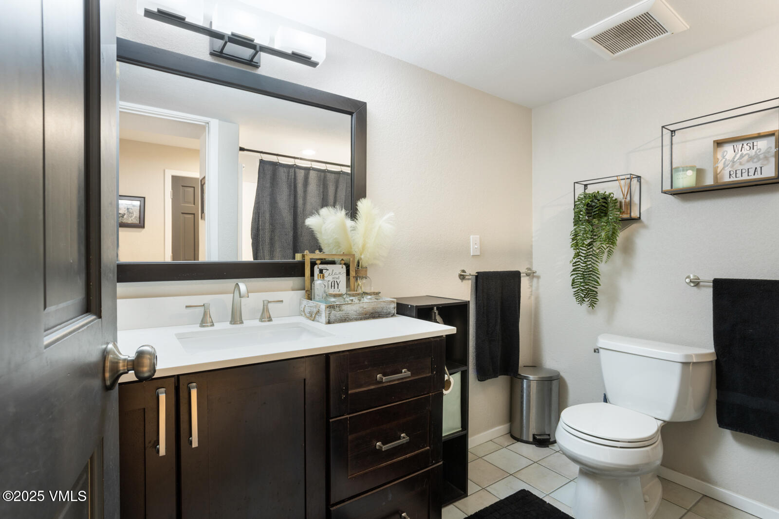 318 Mesa Drive Eagle, CO 81631 - Photo 36 of 44 a bathroom with a toilet sink and mirror