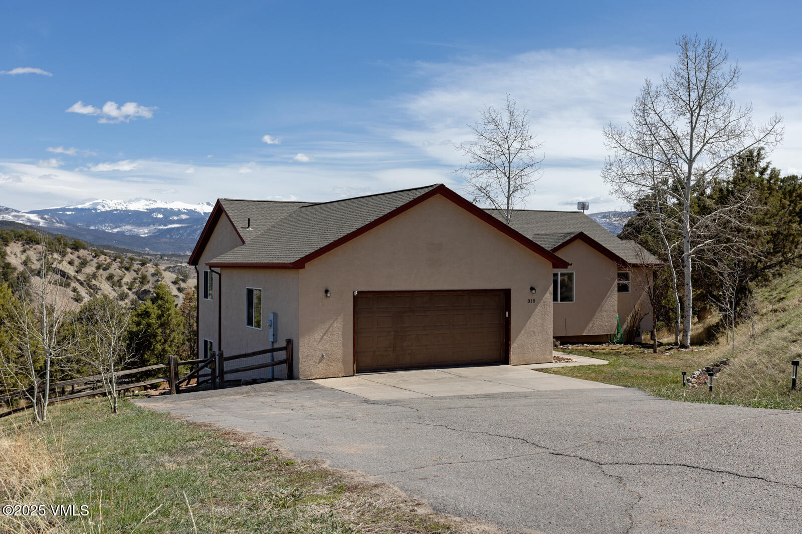 318 Mesa Drive Eagle, CO 81631 - Photo 40 of 44 a view of a house with a yard and garage