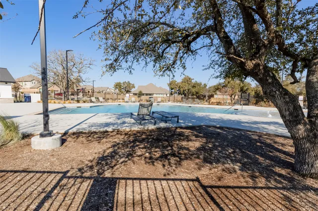 a view of a backyard of the house
