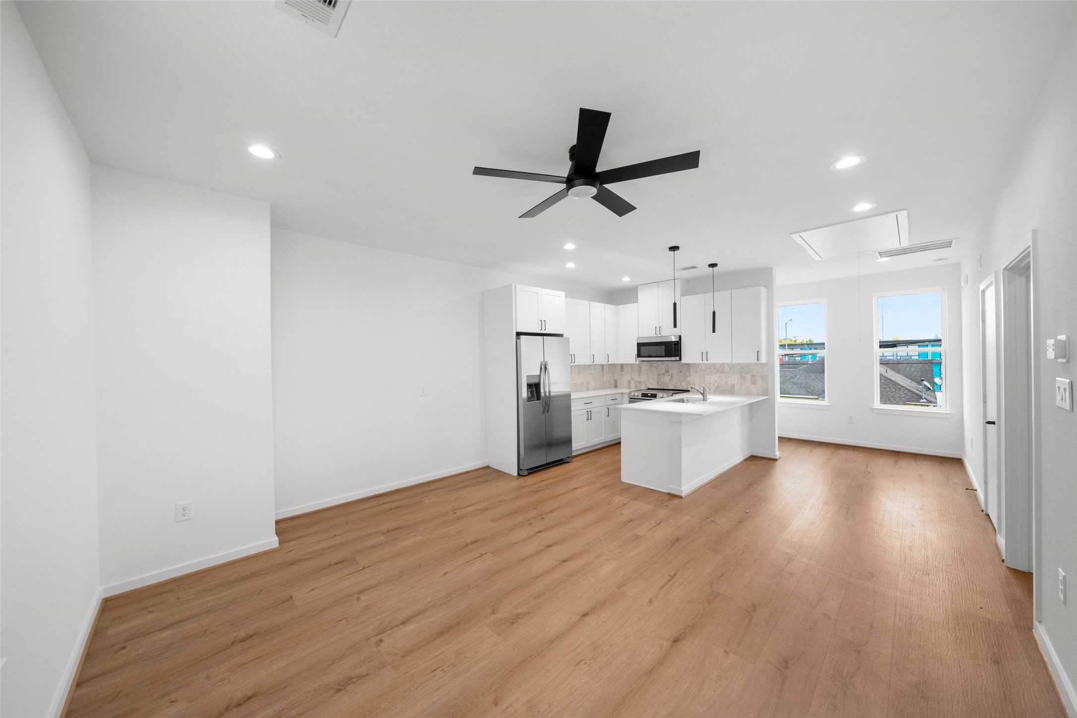 1408 Enid Street, Unit D Houston, TX 77009 - Photo 10 of 26 a view of a kitchen with a sink and a stove top oven