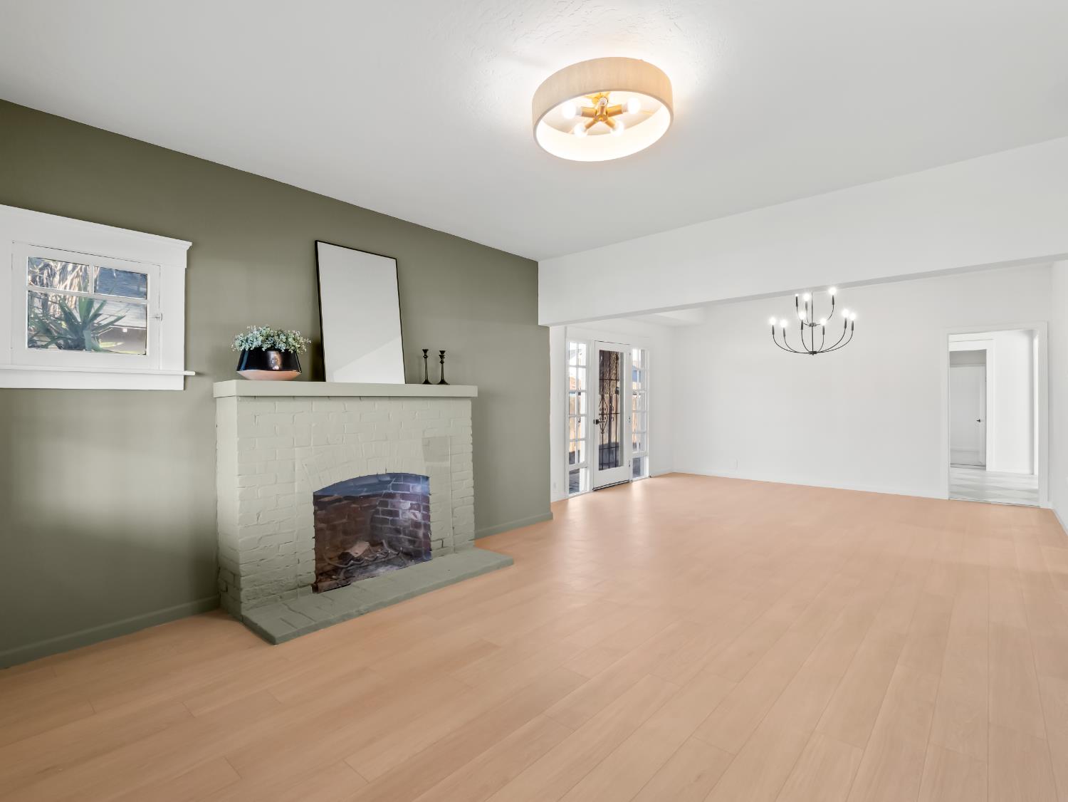 425 West Elm Street Hanford, CA 93230 - Photo 3 of 18 a view of empty room with a fireplace