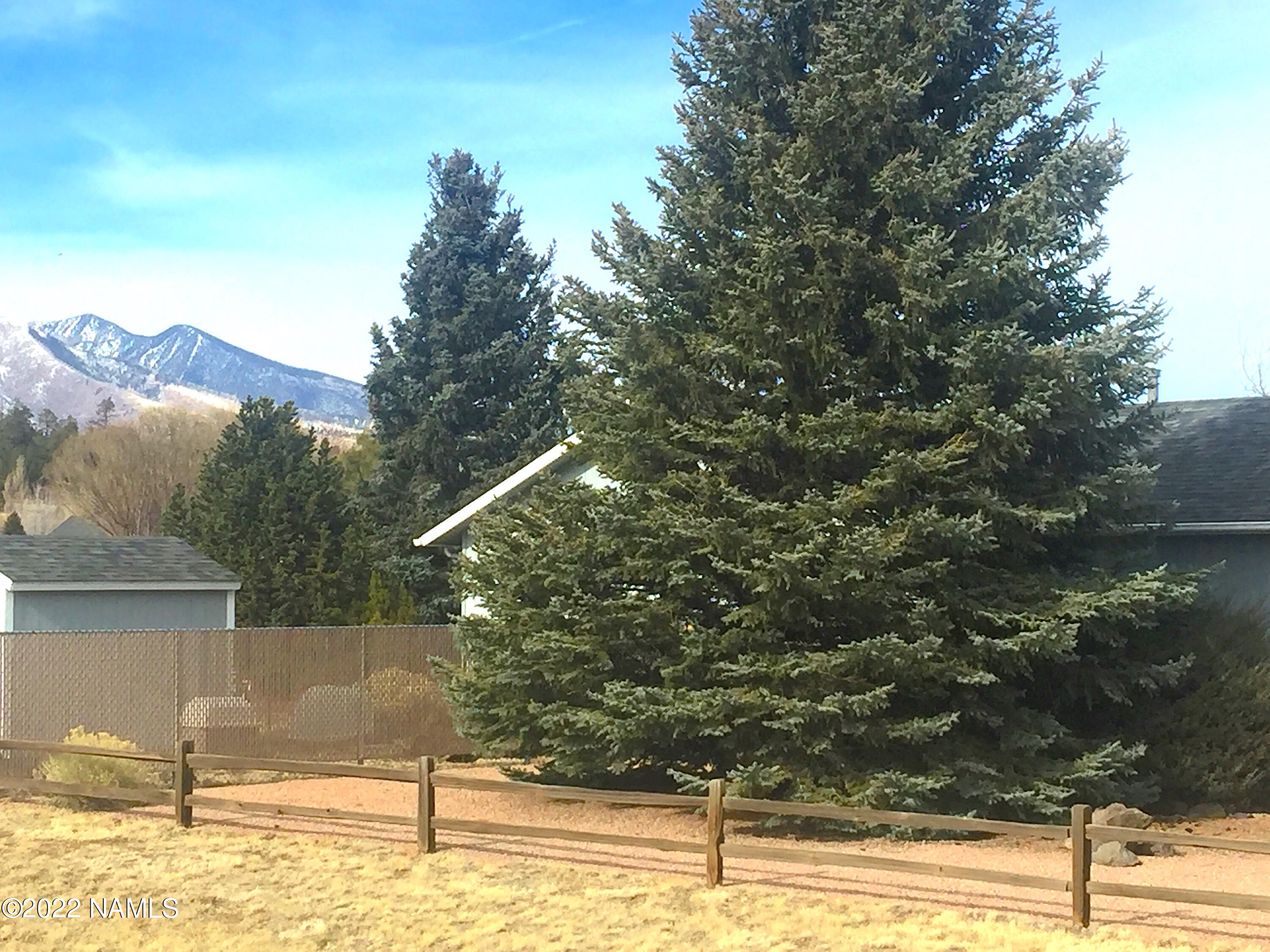 9612 Pioneer Valley Road Flagstaff, AZ 86004 - Photo 42 of 64 1 MatureTreesShedFencePkView