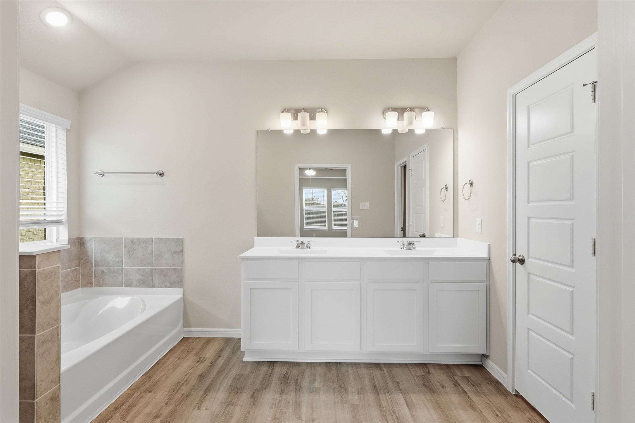 3227 Falling Brk Drive Baytown, TX 77521 - Photo 17 of 28 a spacious bathroom with a tub sink and mirror