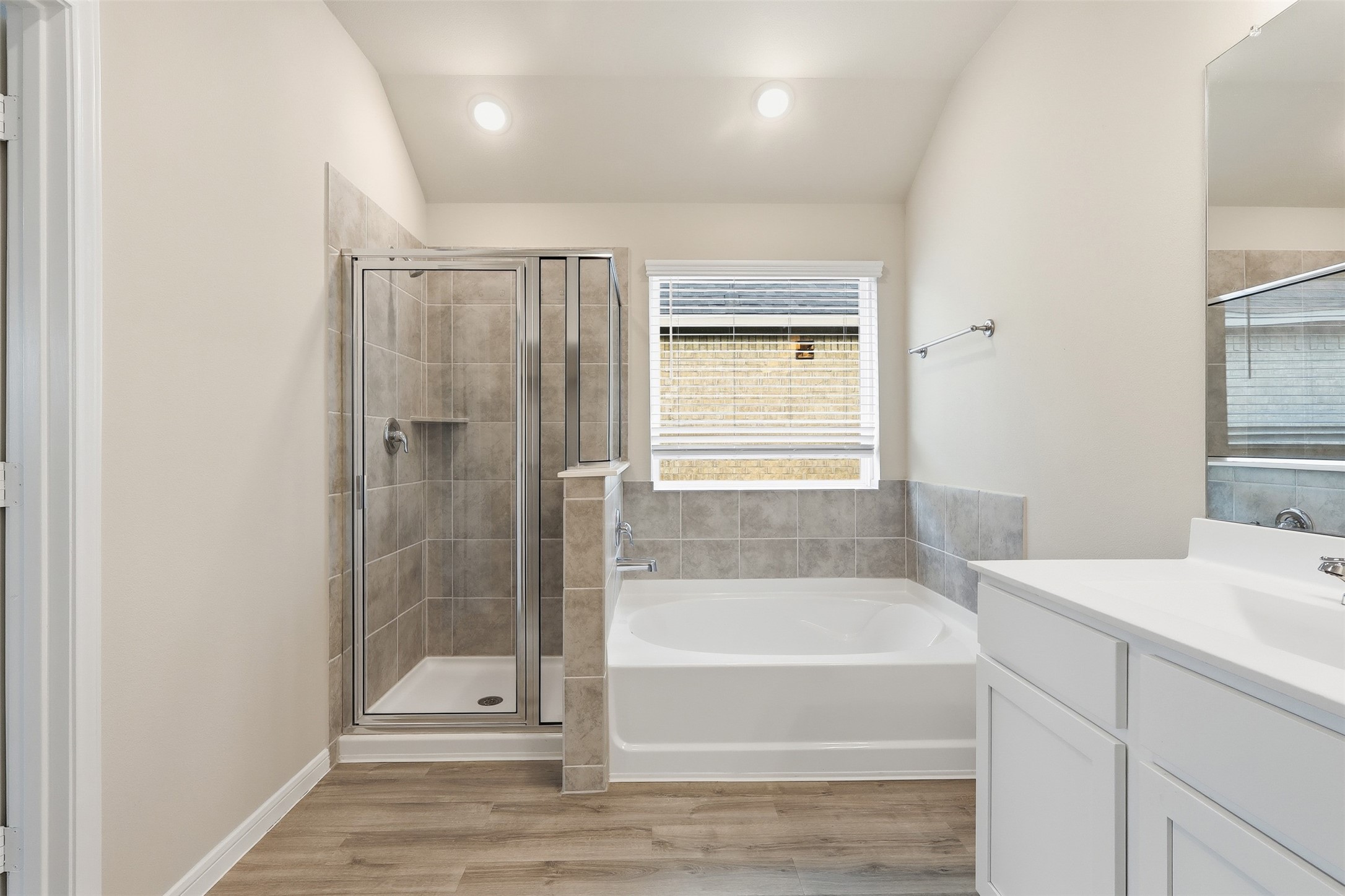 3227 Falling Brk Drive Baytown, TX 77521 - Photo 18 of 28 a bathroom with a tub and shower