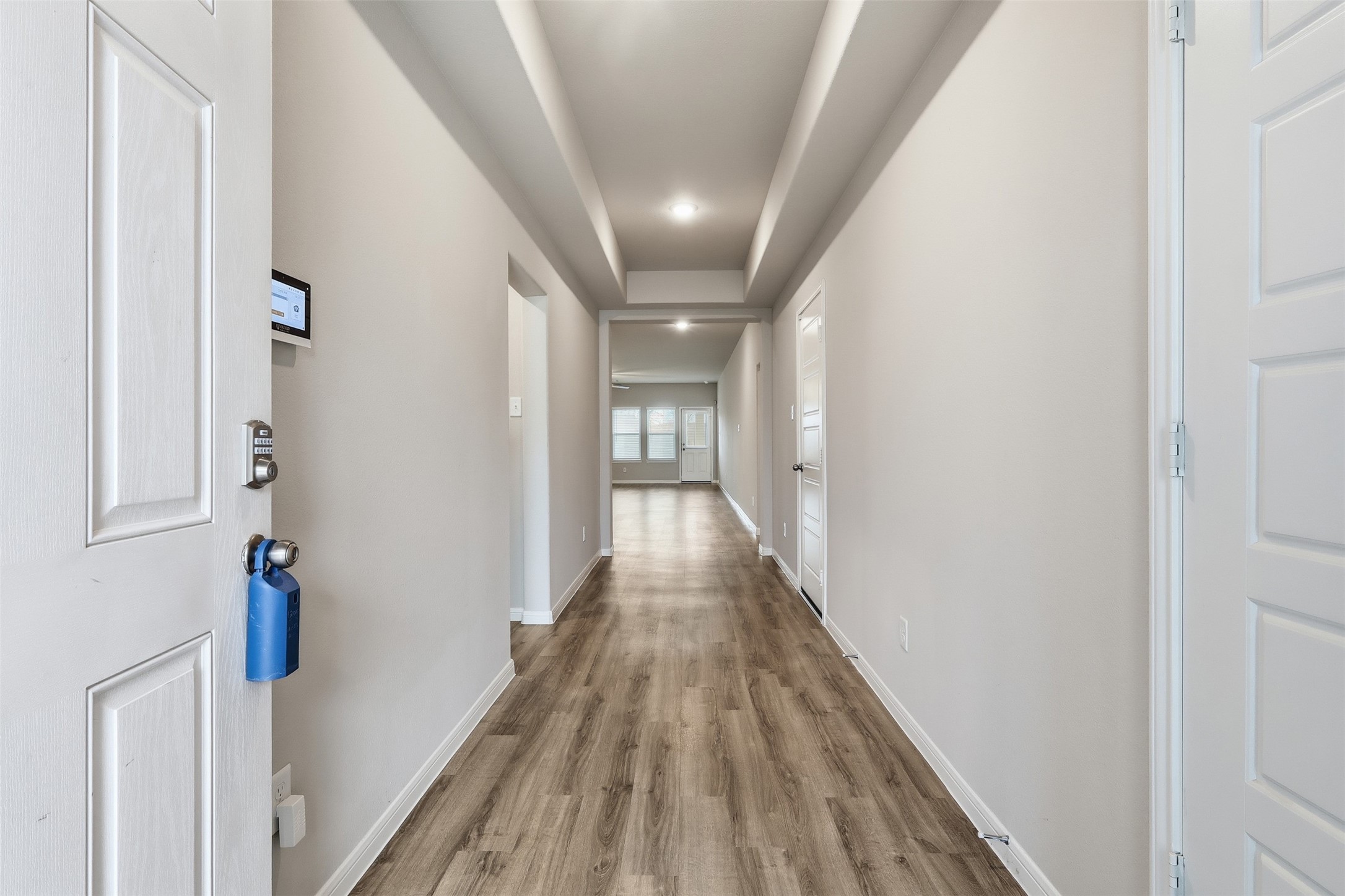 3227 Falling Brk Drive Baytown, TX 77521 - Photo 4 of 28 a view of a hallway with wooden floor