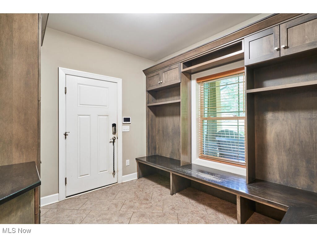 1570 Shade Road Akron, OH 44333 - Photo 6 of 45 There is a large mud room off the garage with custom maple built ins and tiled flooring.