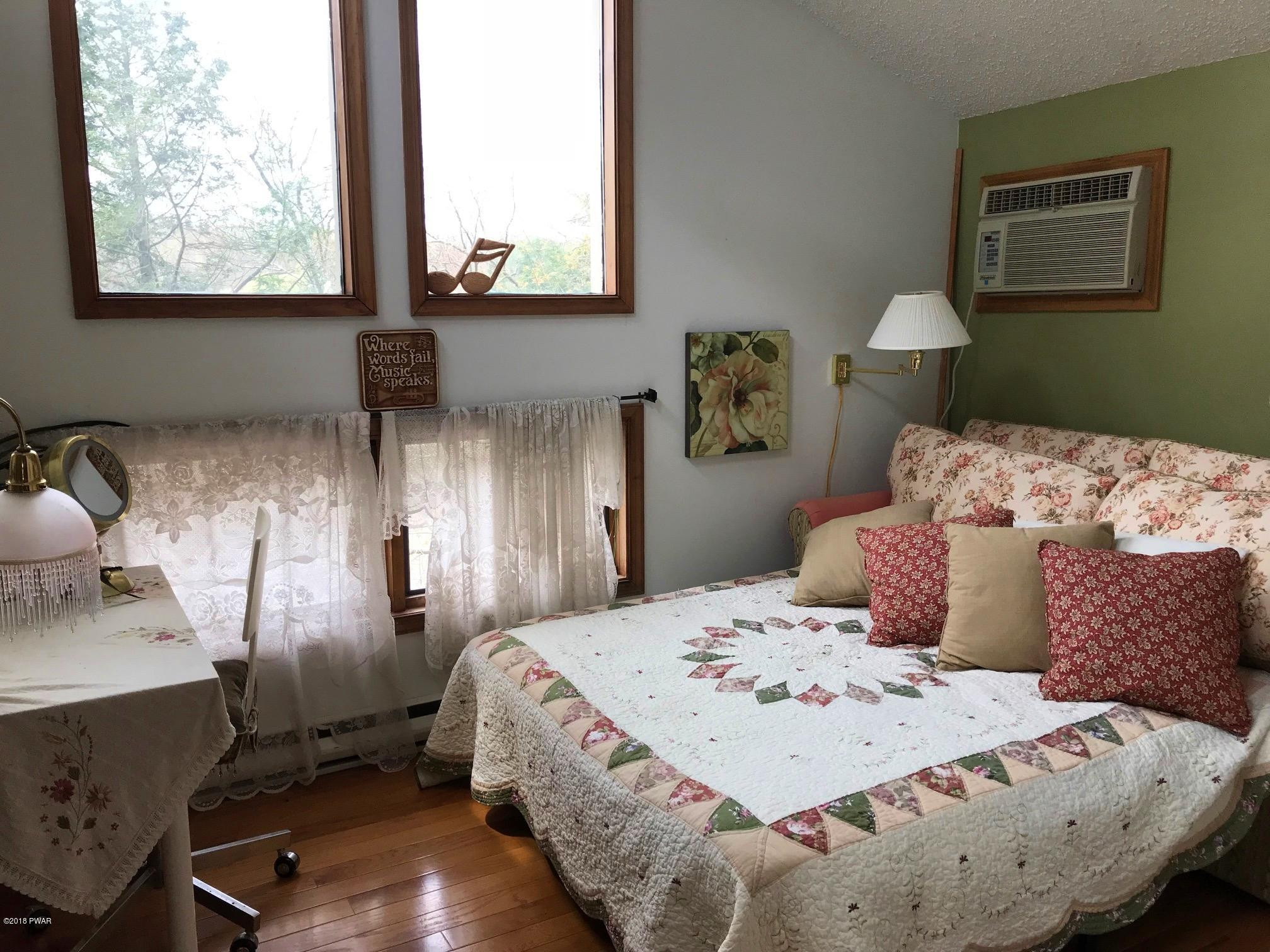 2335 Brookfield Road Lake Ariel, PA 18436 - Photo 14 of 42 a bedroom with a bed and wooden floor