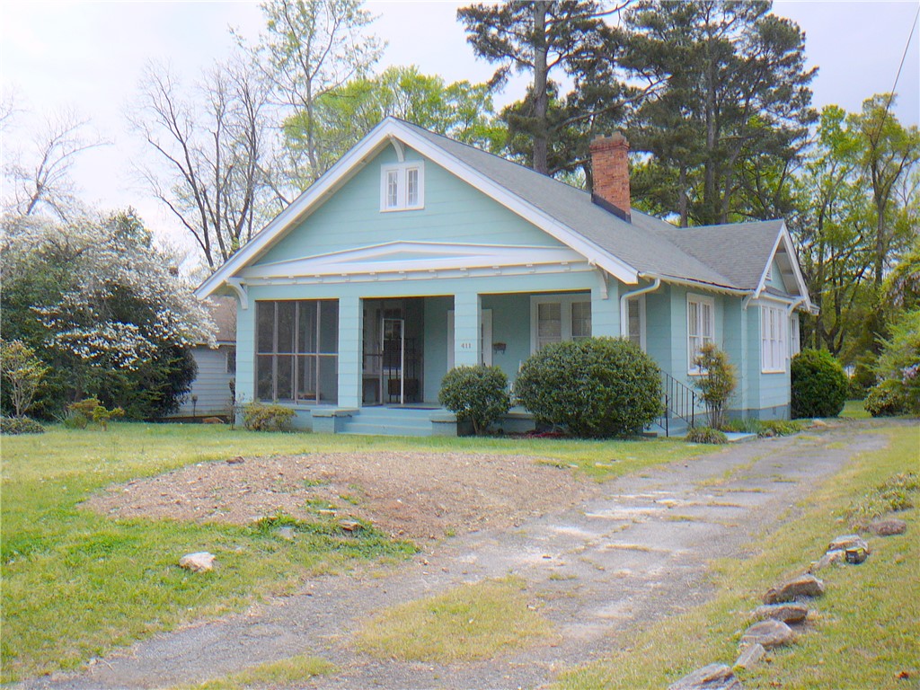411 Central Avenue Anderson, SC 29625 - Photo 1 of 23 Charming home with inviting curb appeal, featuring a classic facade and mature landscaping.
