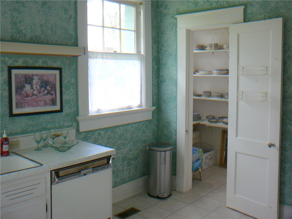 411 Central Avenue Anderson, SC 29625 - Photo 11 of 23 This cozy kitchen features practical appliances and a convenient pantry, perfect for everyday living.