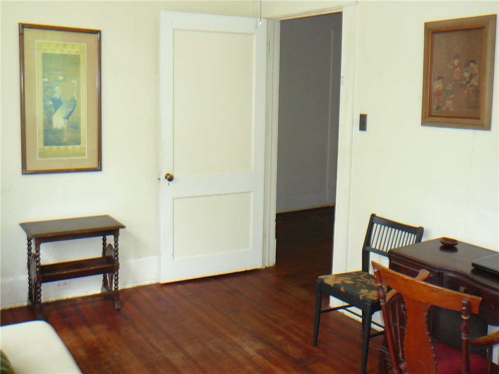411 Central Avenue Anderson, SC 29625 - Photo 13 of 23 This interior space features beautiful hardwood flooring, providing a warm and inviting atmosphere.