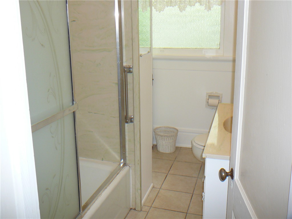 411 Central Avenue Anderson, SC 29625 - Photo 14 of 23 This bathroom features practical fixtures and a window for natural light.