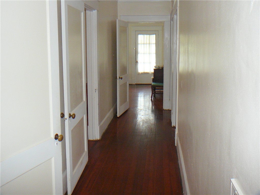411 Central Avenue Anderson, SC 29625 - Photo 16 of 23 This spacious hallway offers seamless flow, connecting rooms with classic charm.