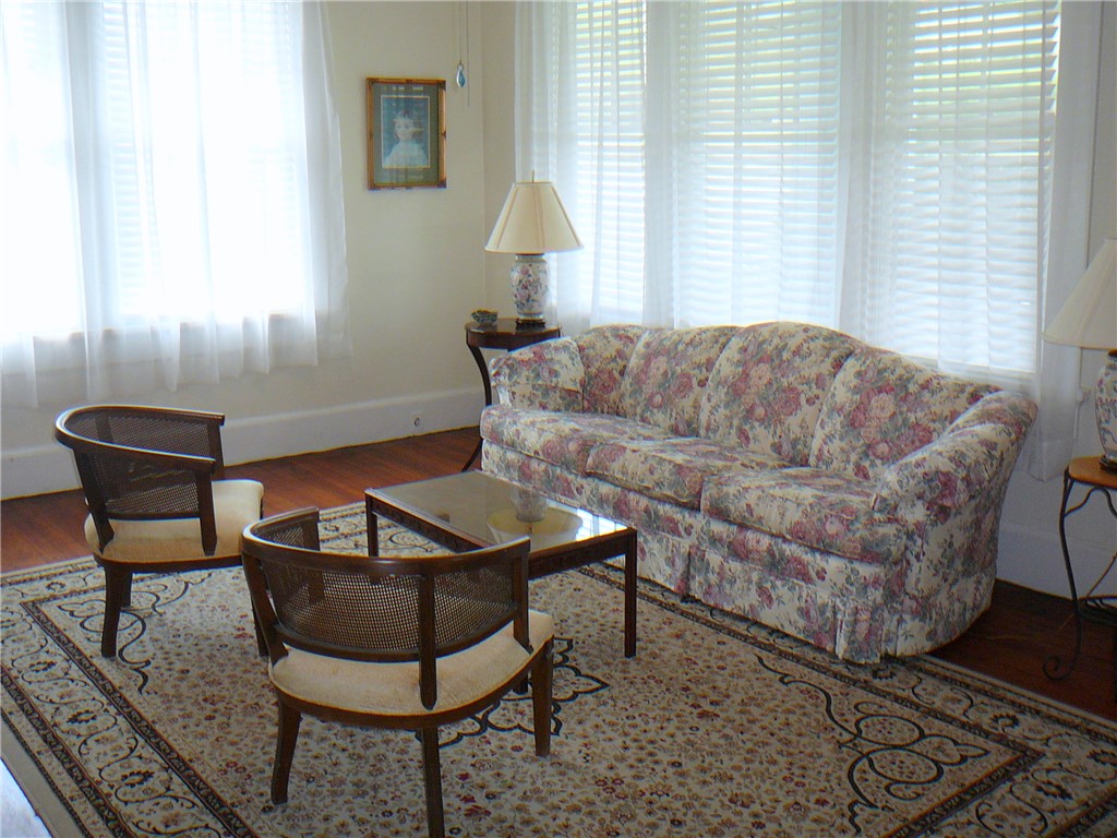 411 Central Avenue Anderson, SC 29625 - Photo 17 of 23 This bright living room offers an inviting space for relaxation and gatherings.