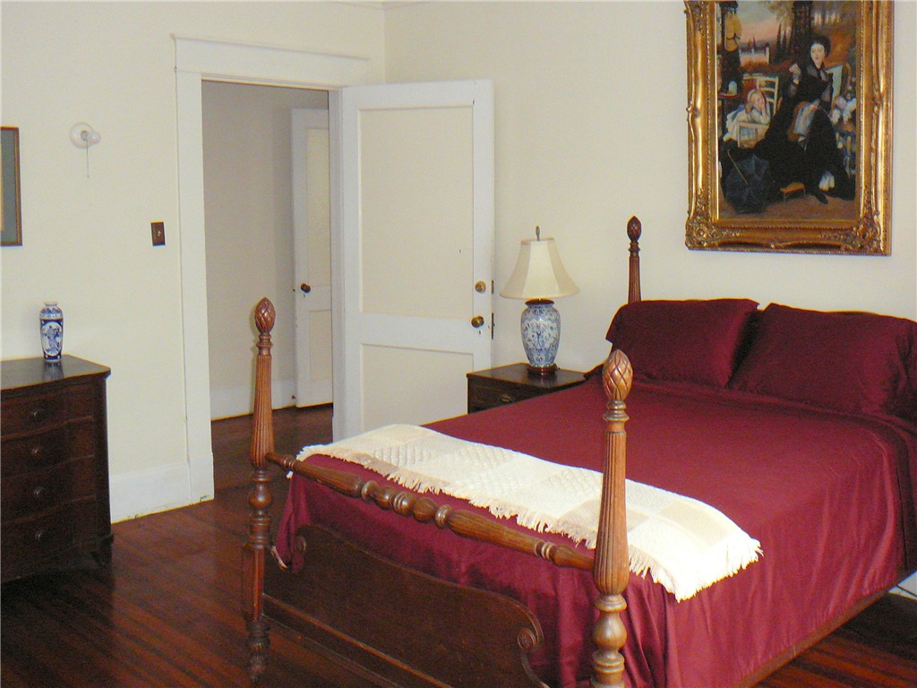 411 Central Avenue Anderson, SC 29625 - Photo 19 of 23 This cozy room offers hardwood floors and a warm, inviting atmosphere for peaceful rest.